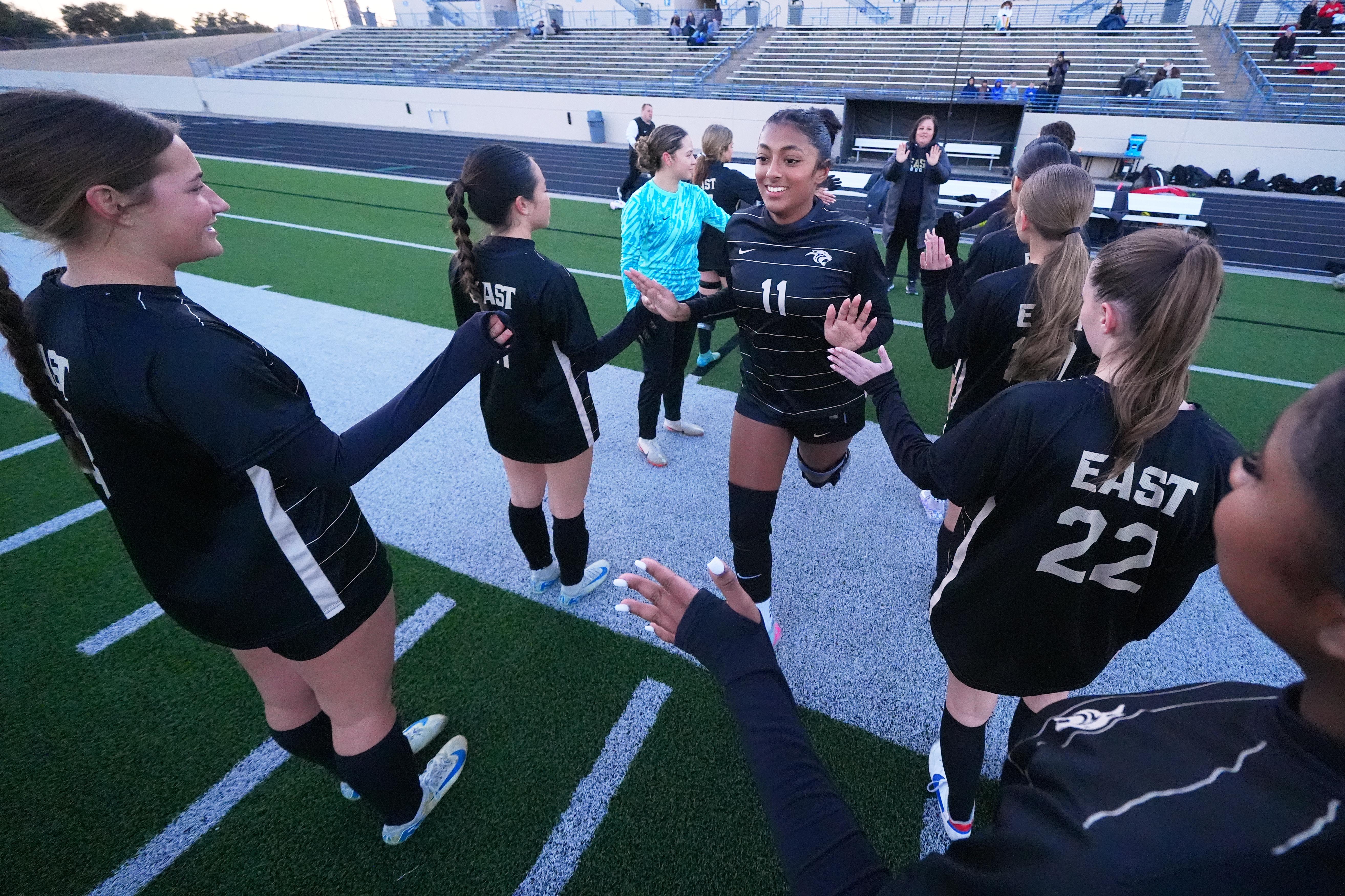 Plano East varsity soccer player Aliya Jacob is introduced onto the field.