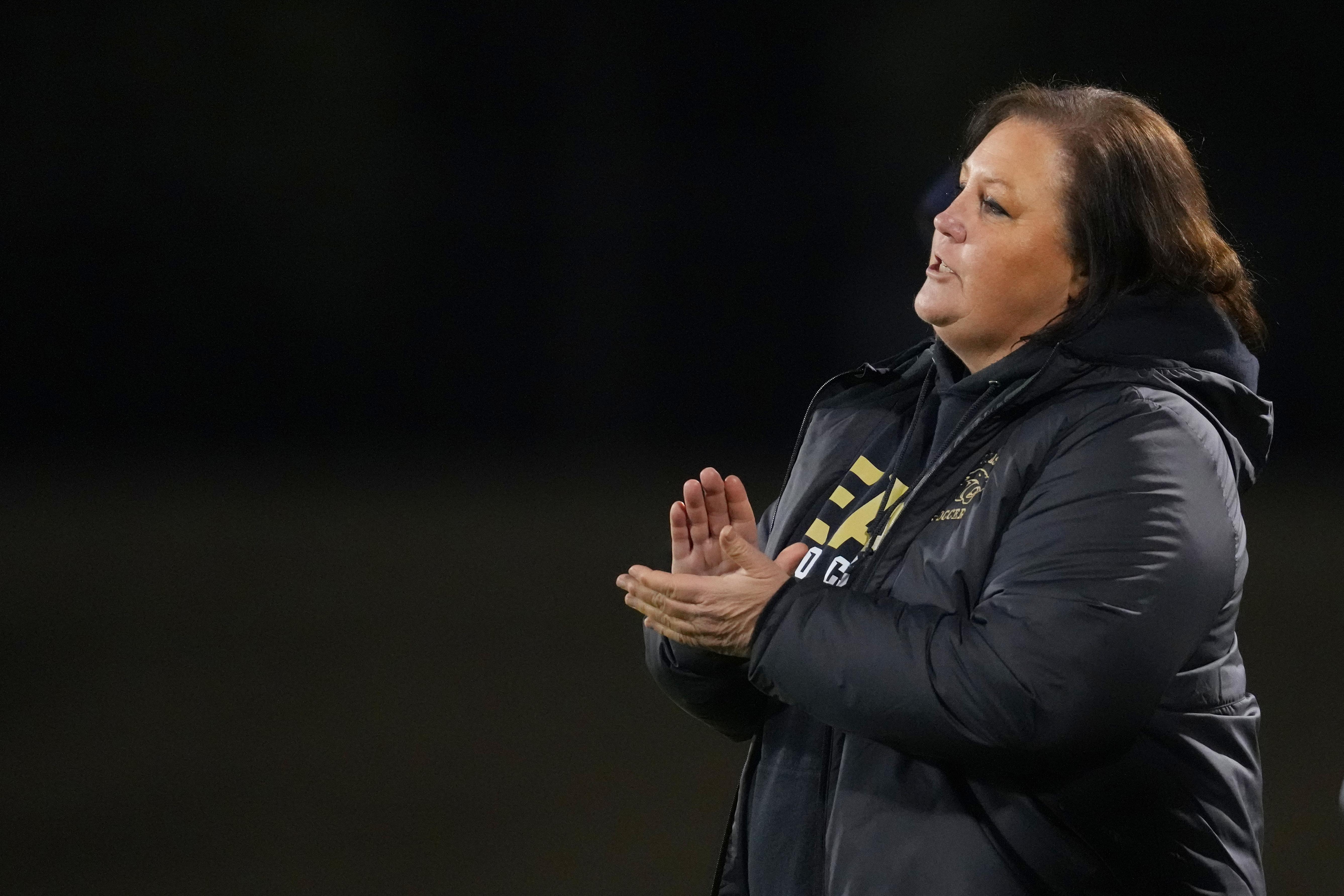 Plano East varsity soccer head coach Cristy Cooley reacts during a game.