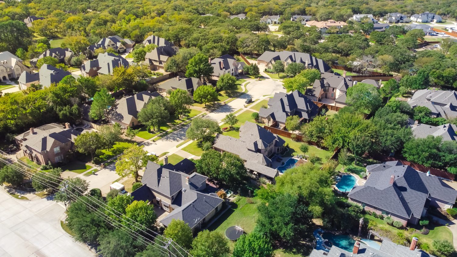 A residential neighborhood with trees in Grapevine, Texas