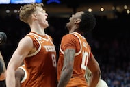 Texas center Matas Vokietaitis (8) celebrates with forward Nic Codie (10) after the second...