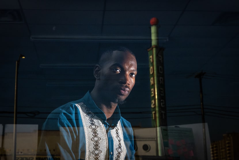 Nijeul X, former executive and artistic director of the Forest Theater, looks out the window...