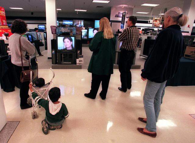 Feb. 3, 1999: Sears employees and customers stop to watch the Monica Lewinsky interview on Wednesday night at Ridgmar Mall.