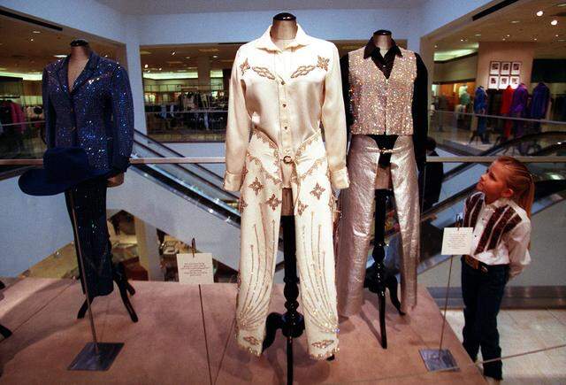 Jan. 29, 1999: Sawyer Burmeister-Mowery, 6, of Weatherford looks at part of the collection of outfits owned by the woman she was named for, Cowgirl Hall of Famer Fern Sawyer, on display at Neiman Marcus in Ridgmar Mall. The girl's mother, Shelly Burmeister-Mowery, is also a member of the hall of fame and was a long-time friend of Fern Sawyer.