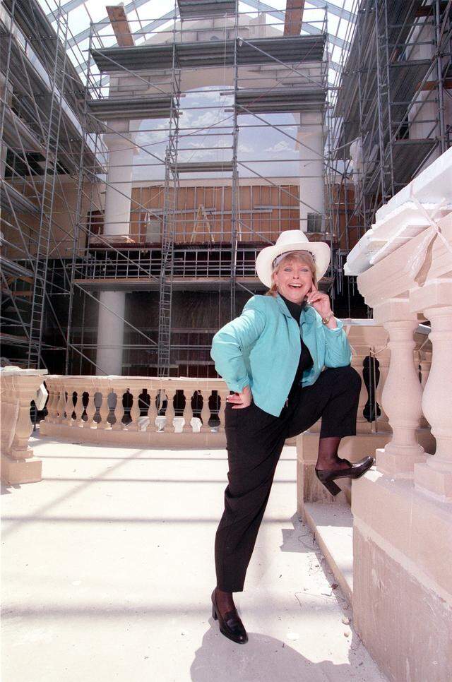 Aug. 5, 1999: Patricia West, general manager at Ridgmar Mall, poses in her cowboy hard hat amid the refurbishing construction at the mall in Fort Worth.