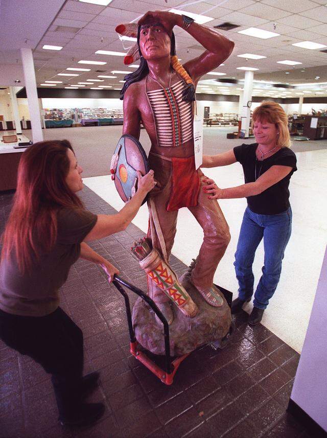 April 7, 1999: Katy Kares, left, and Stacey Hunter use a dolly to move a near-life size Native American statue for a sale of the contents from the Museum Rock Shop which closed due to the death of the owner. The sale consists of all forms of rocks, shop decorations and sporting goods will be taking place at the old Service Merchandise on the grounds of Ridgmar Mall.
