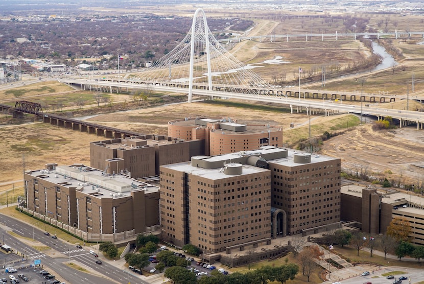 The Margaret Hunt Hill Bridge is seen above the Lew Sterrett Justice Center with North Tower...