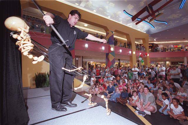 July 21, 2000: Puppeteer John Hopkins with Le Theatre de Marionette performs before a crowd at Ridgmar Mall's Opening Celebration in west Fort Worth. Since 1998 the mall has ungone a complete interior remodeling costing $70 million.