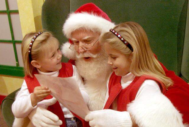 Dec. 5, 2002: Betsy, 5, and Becca Bell, 7, both of Benbrook talk to Santa Claus about their Christmas list at Ridgmar Mall.