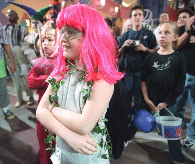 Nov. 1, 2000: Halloween at Ridgmar Mall: Taylor Millsap, 8, dressed as 'poison ivy' watches younger kids compete in the costume contest before her turn.