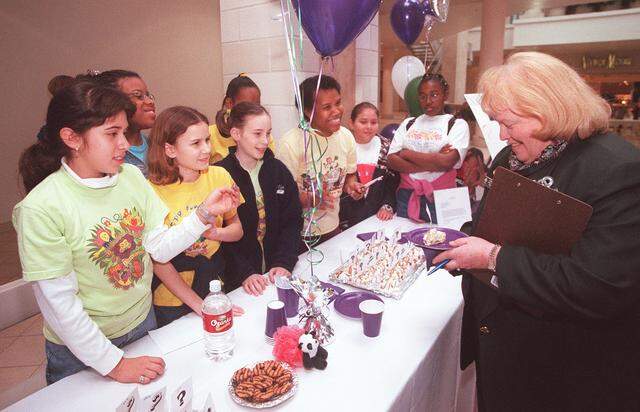 Jan. 13, 2001: Lisann Petters, the president of the Circle T Council, judges a dessert made by Troop 2815. Girl scouts met at Ridgmar Mall for the 3rd annual Circle T Girl Scouts Cookie Fest, an event to kick off the cookie selling.