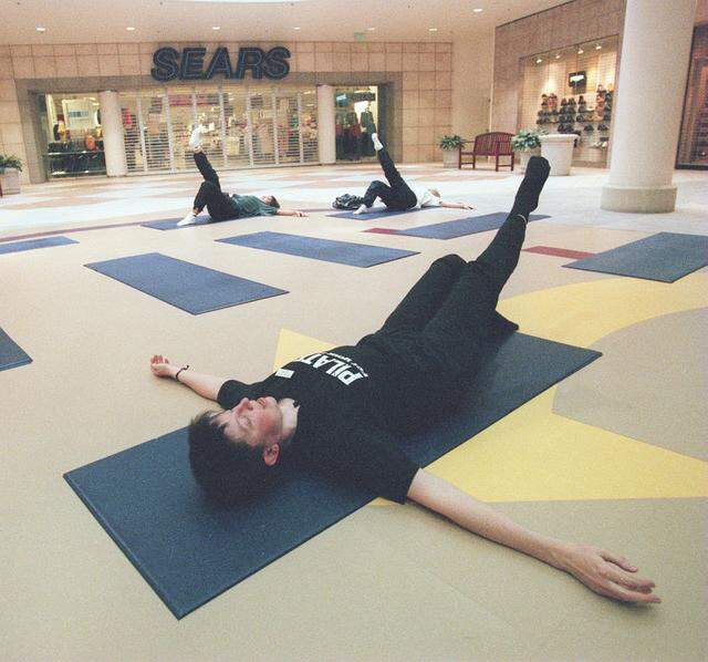 Feb. 15, 2001: Pilates instructor Kerry Kreiman, front, of Dancescape Studio in Fort Worth, teaches a free mat class at Ridgmar Mall in Fort Worth. Ridgmar Mall has offered the exercise class on Thursday mornings since January. The classes are taught on the lower level in front of Sears.
