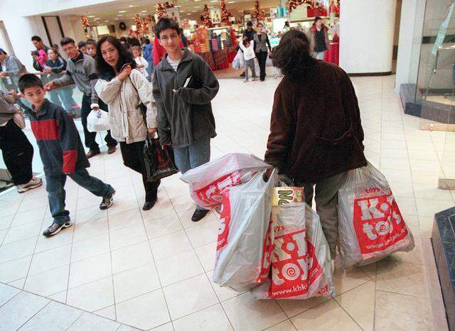Nov. 24, 2000: Some shoppers at Ridgmar Mall are loaded down with purchases made the day after Thanksgiving.