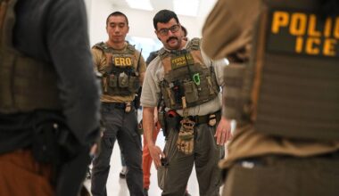 Federal immigration agents are seen at Newark Liberty International Airport, Monday, March 23, 2026, in Newark, N.J. (AP Photo/Angelina Katsanis)