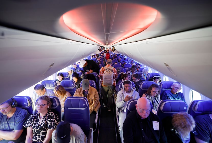 Southwest Airlines passengers settle in gfor an early nonstop flight to Seattle-Tacoma...