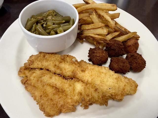 Fried catfish with green beans and french fries is a Friday special at K & K Cafe in White Settlement, Texas, seen March 28, 2026.