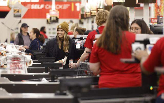 Customers check out at the registers of the Fort Worth Alliance H-E-B on Wednesday, April 10, 2024. Hundreds lined up for the opening of the store.