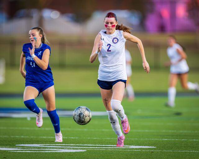 Grapevine’s Chloe O’Steen (2) out races a Joshua defender in a Class 5A Division 2 area-round match on Tuesday, March 24, 2026 at Brewer High School in Fort Worth, Texas.