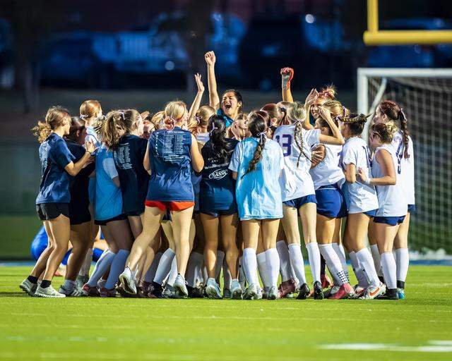The Grapevine girls soccer team celebrates after defeating Joshua in a Class 5A Division 2 area-round match on Tuesday, March 24, 2026 at Brewer High School in Fort Worth, Texas.