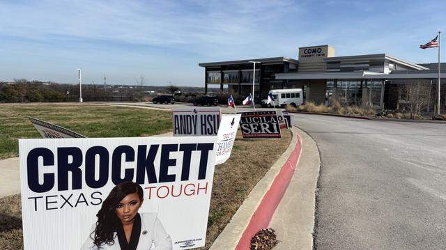 Candidate signs lined the driveway leading up to the Como Community Center on the first day of early voting, Feb. 17, 2026.