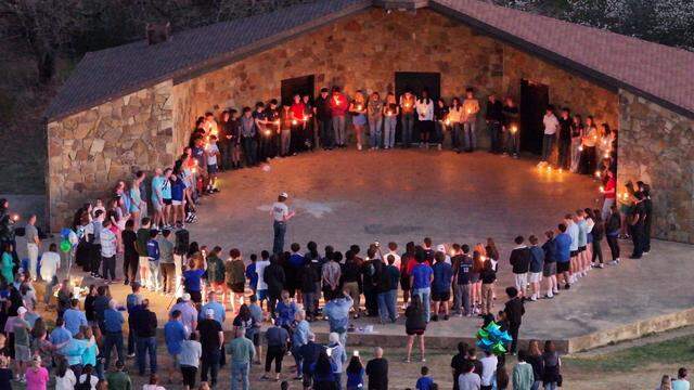 Friends and family gather at Arlington’s Veterans Park on Friday, Feb. 27 to honor 14-year-old Riley Jordan, who was killed in a shooting at his home.