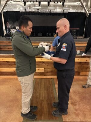 Honor Guard folding a flag. 