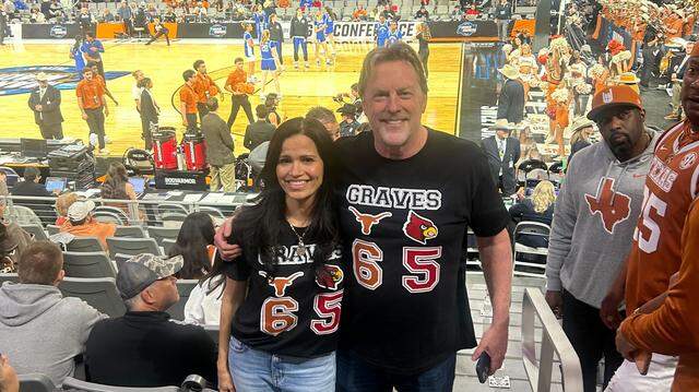 Nicole Graves (left) and John Graves wear shirts representing their daughters Rebekah Graves, who plays for Louisville, and Sarah Graves, who plays for Texas, at Sweet 16 games in the NCAA Tournament on Saturday at Dickies Arena in Fort Worth. Nicole Graves (left) and John Graves (right) wearing a shirt representing their daughters Rebekah Graves, who plays for Louisville, and Sarah Graves, who plays for Texas.