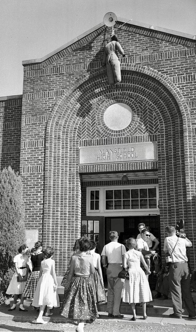 An effigy, the second at the school, was left hanging from the roof over the door of Mansfield High School on Aug. 31, 1956. It hung there for days and only white students enrolled during a school desegregation incident.