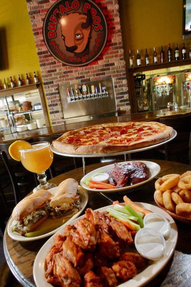 Pizza, chicken wings, chicken tenders, an A-Bomb sandwich and Blue Moon beer, seen at Buffalo Bros in Fort Worrh, Texas, Nov. 28, 2007.