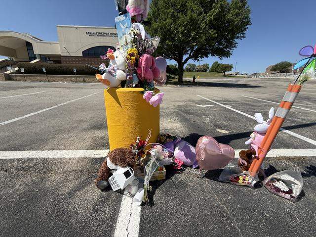 Friends of the victims and other residents in the community have left stuffed animals and flowers as a memorial outside a Birdville ISD administration building near where Raissa Thatukila, 33, and her 6-year-old daughter, Nathy Mbuyi, were shot and killed on Friday, March 27, 2026.