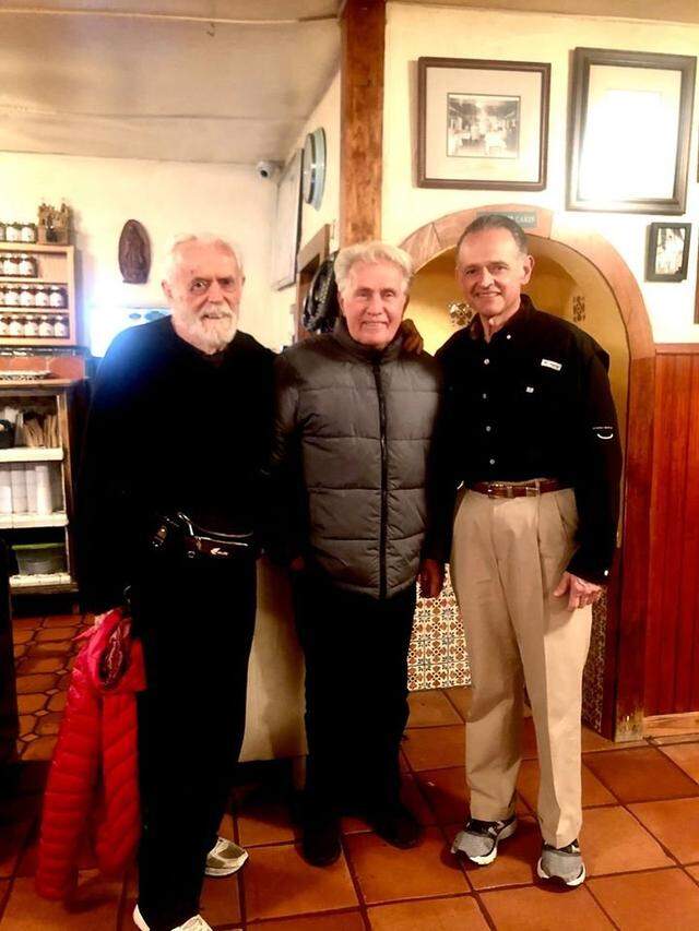 In this file photo from Nov. 13, 2019, Martin Sheen (middle) poses with actor Matt Clark (left) and Joe T. Garcia's co-owner Joe Lancarte (right) inside the restaurant Monday night. Sheen is in "12 Mighty Orphans," an upcoming movie about the Masonic Home Mighty Mites high school football team in Texas.