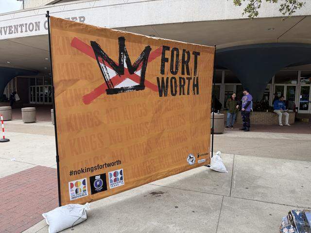 Fort Worth No Kings signs were displayed across General Worth Square during the protest Saturday.