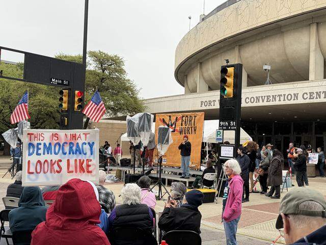Speakers address to rally attendees Saturday in front of the Fort Worth Convention Center before the No Kings march through Sundance Square.