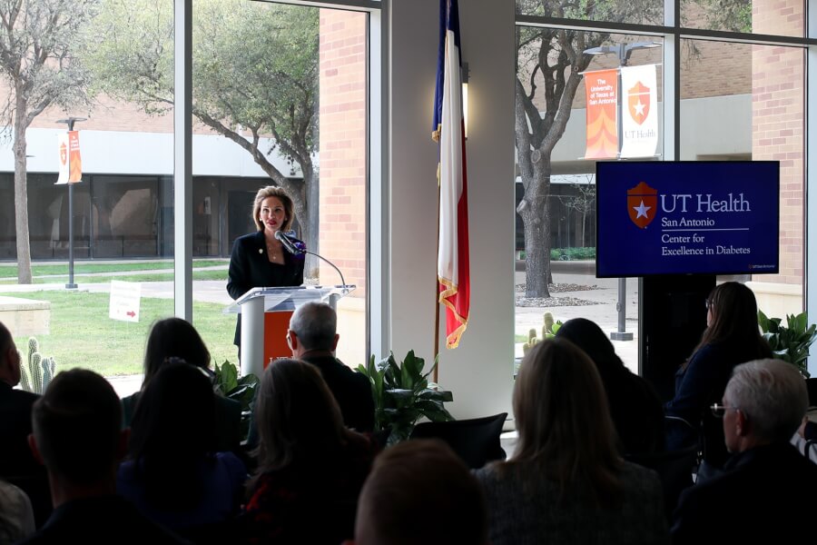 Dr. Solis-Herrera makes remarks at the event.