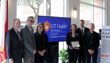 Leaders and honored guests gather for a photo.