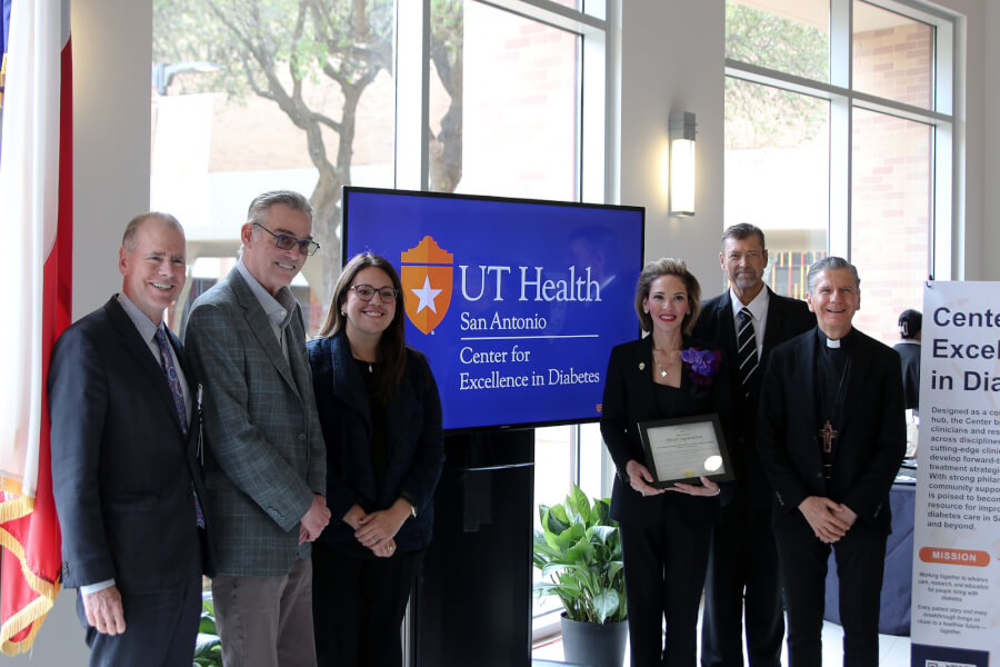 Leaders and honored guests gather for a photo.