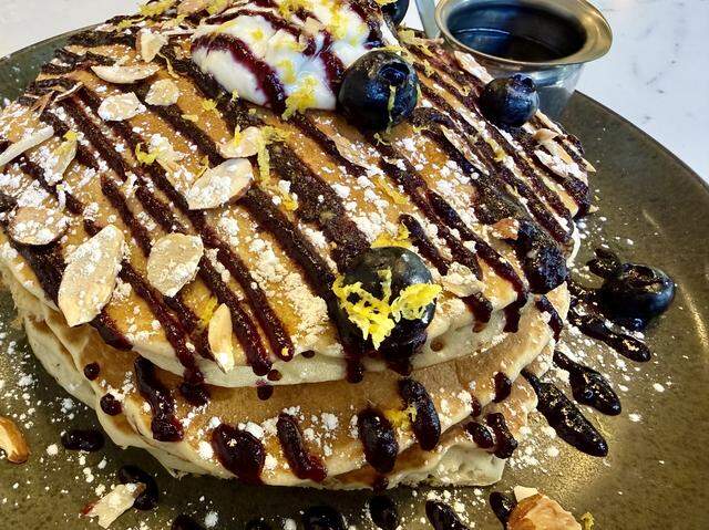 Lemon ricotta pancakes with blueberry drizzle at Top Of The Morning.