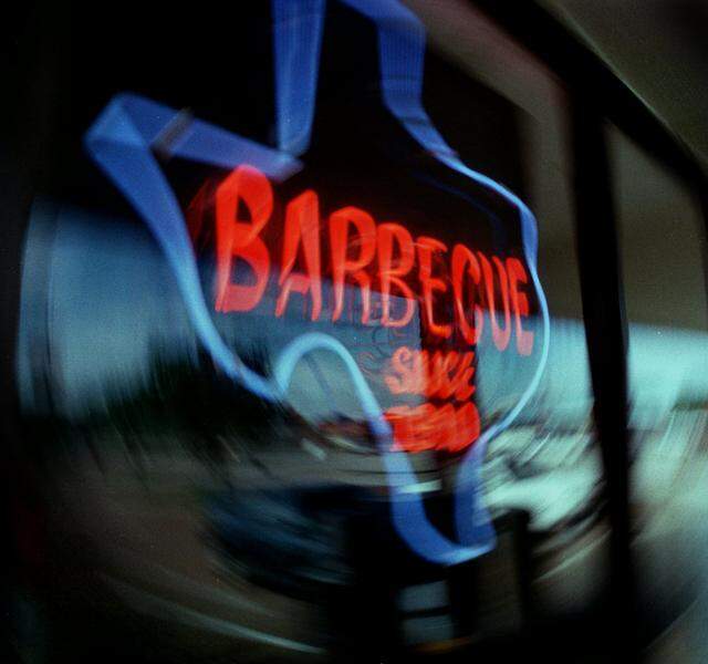 David’s Barbecue in Pantego, Texas, is a fourth-generation restaurant that traces back to 1910 and Red Bryan’s in Dallas. The place is decorated with photos of family, friends, and guests, seen July 17, 1996.