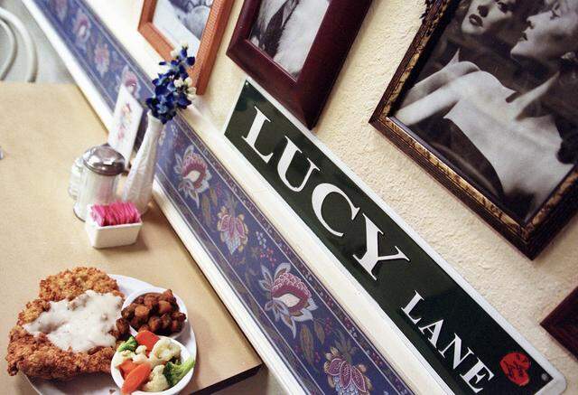 Chicken-fried chicken with a side of fried okra and carrots, broccoli and cauliflower among the “I Love Lucy” memorabilia at Bluebonnet Cafe in Haltom City, Texas, unchanged since this scene January 16, 2004.