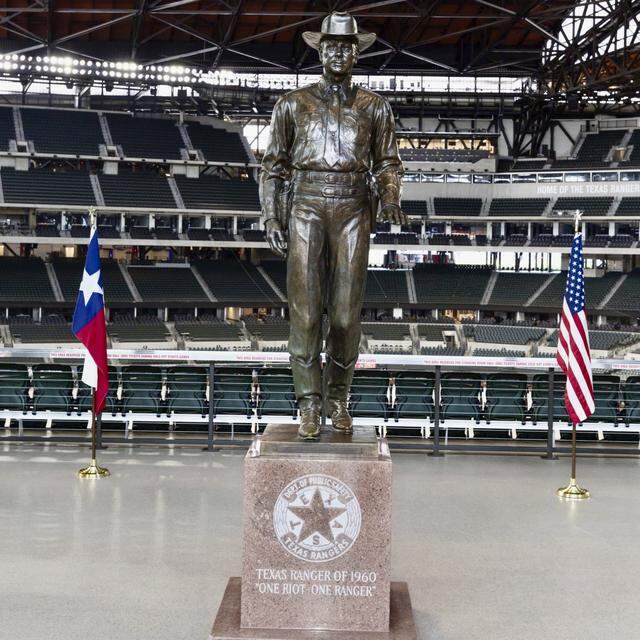 The 1961 statue “Texas Ranger of Today,” removed from Dallas Love Field, has been moved to Globe Life Field despite its model’s connection to the ugly Mansfield Crisis school desegregation incident in 1956.