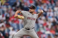 Arizona Diamondbacks' Jalen Beeks pitches during the 10th inning of a baseball game against...