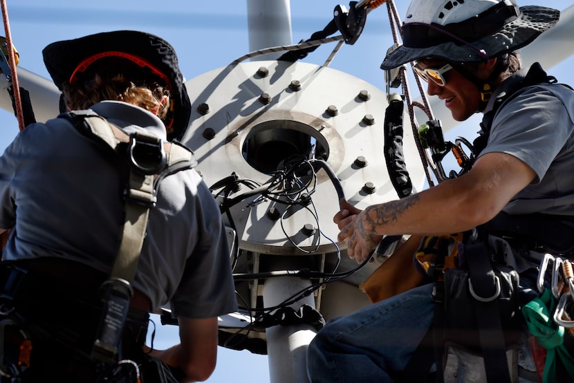 Rope access technicians Ian Porter (left) and Kain McLaughlin of Highpoint Access make...