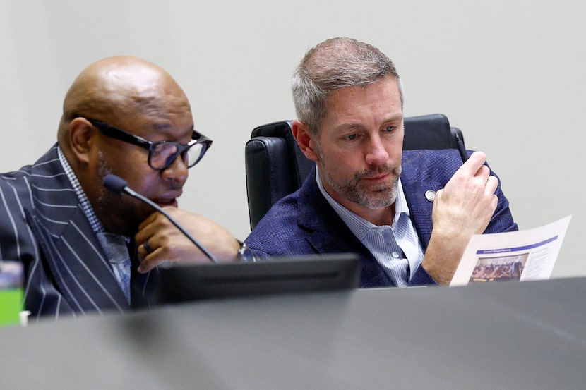 Chad West, Committee on Finance chair (right), and Council member Maxie Johnson during a...