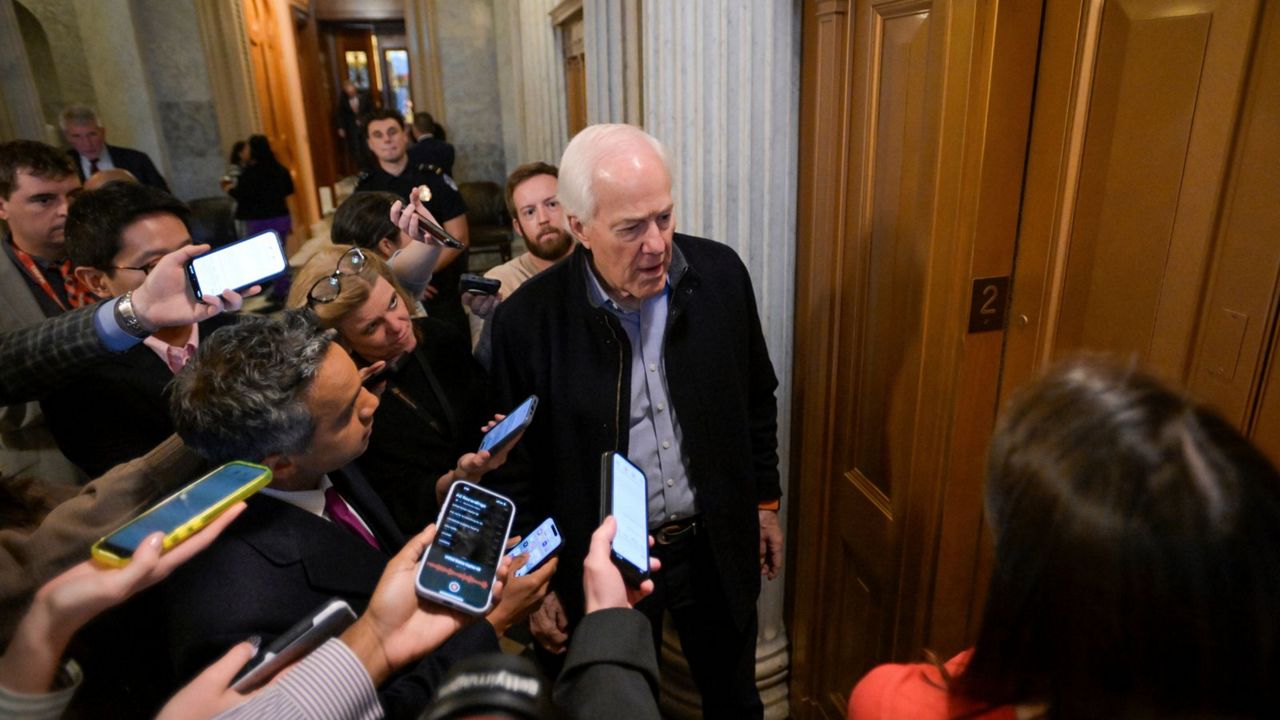 Sen. John Cornyn, R-Texas, talks with reporters as he leaves the Senate chamber during a Senate war powers vote on Iran on Capitol Hill, Wednesday, March 4, 2026, in Washington. (AP Photo/Rod Lamkey, Jr.)
