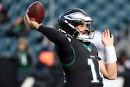 Philadelphia Eagles quarterback Sam Howell (14) throws the ball before an NFL football game...