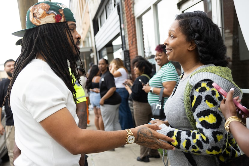 Keith Lee (left), influencer, food critic and Dallas resident, speaks to Kristel Clouse as...