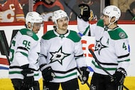 Dallas Stars' Sam Steel, center, celebrates his goal with teammates Matt Duchene, left, and...