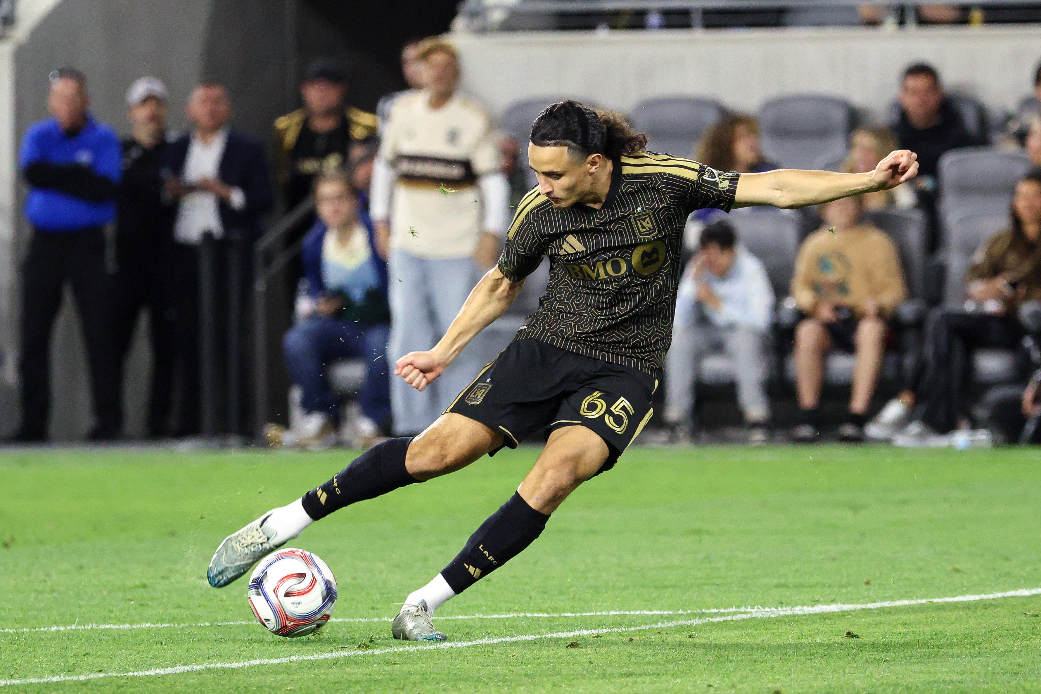 LAFC midfielder Amin Boudri (65) takes a goal shot against...