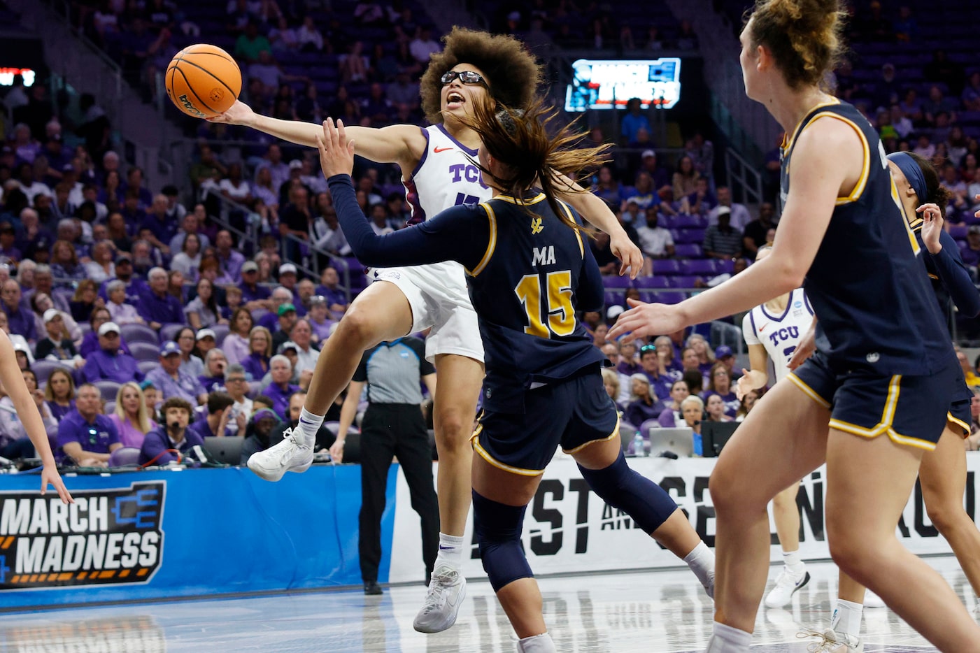 TCU guard Olivia Miles (5) lays up a ball as UC San Diego guard Sabrina Ma (15) and UC San...