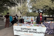 Supporters of the Prairieland ICE detention center shooting hand our fliers outside the...