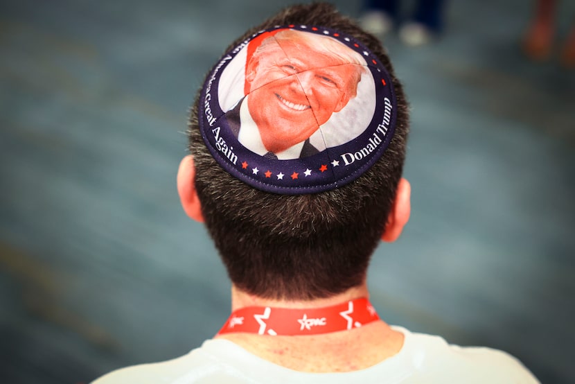 Ariel Kohane wears a kippah with a photo of President Donald Trump during the Conservative...